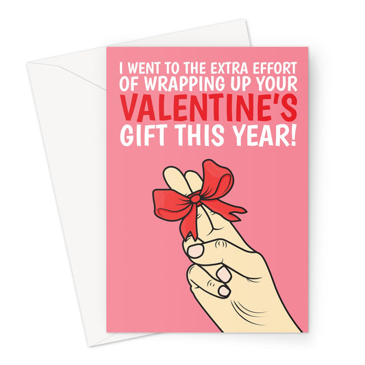 A pink and red Valentine's Day card with a white hand, and two fingers wrapped in a red bow which reads "I went to the extra effort of wrapping up your valentine's gift this year!"