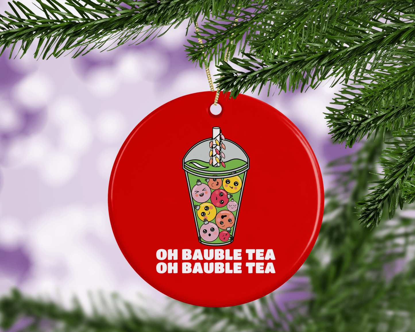 A round ceramic Christmas decoration to hang from a tree. Has a hand drawn illustration of boba bubble tea with baubles instead of tapioca bubbles.