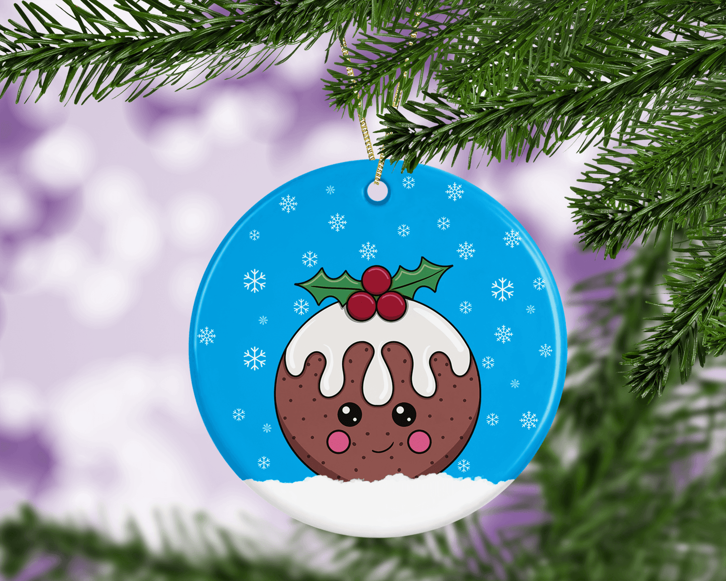 A round ceramic Christmas decoration to hang from a tree. Has a hand drawn illustration of a cute figgy pudding with a blue snowy background.