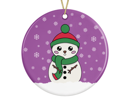 A round ceramic Christmas decoration to hang from a tree. Has a hand drawn illustration of a cute snowman with smiley face and with a purple snowy background.